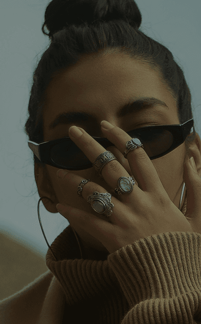 Model wearing hand-selected rings and accessories